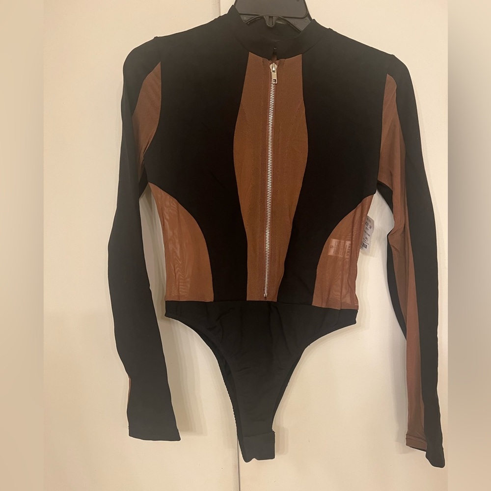 Black and brown ( the brown is sheer ) long sleeve bodysuit. Never worn.